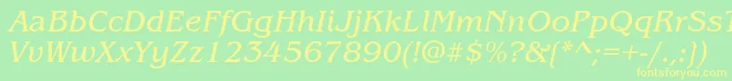 ItcBenguiatBookItalic-fontti – keltaiset fontit vihreällä taustalla