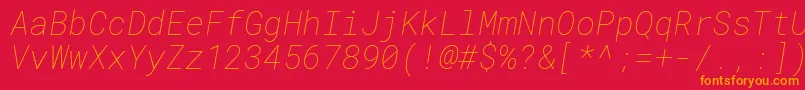 Czcionka RobotomonoThinitalic – pomarańczowe czcionki na czerwonym tle