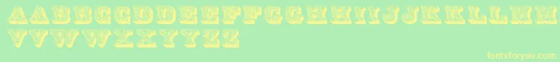 Czcionka Dslettres – żółte czcionki na zielonym tle