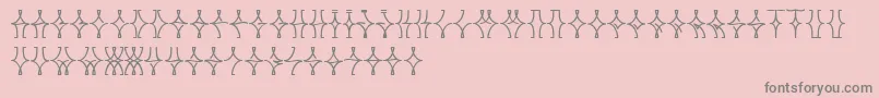 フォントNellyfrdNormal – ピンクの背景に灰色の文字