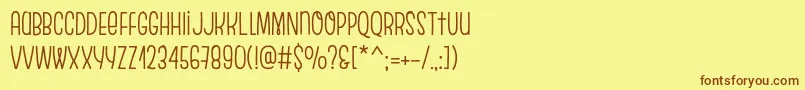 フォントEscalopeCrustOne – 茶色の文字が黄色の背景にあります。