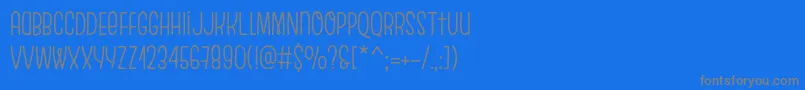 EscalopeCrustOne-Schriftart – Graue Schriften auf blauem Hintergrund