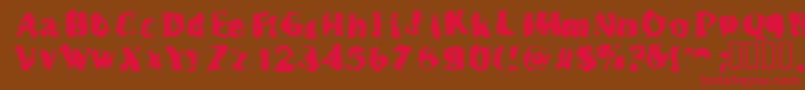 Inspecto Font – Red Fonts on Brown Background