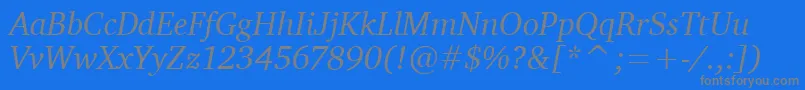 Fonte CharterItcTtItalic – fontes cinzas em um fundo azul
