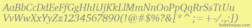 CharterItcTtItalic-fontti – harmaat kirjasimet keltaisella taustalla