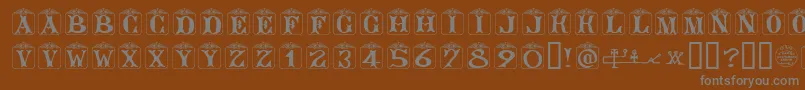 AngelotsUnregistered-fontti – harmaat kirjasimet ruskealla taustalla