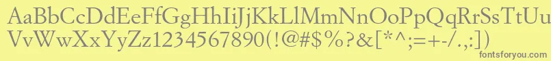 フォントSimoncinigaramondstd – 黄色の背景に灰色の文字