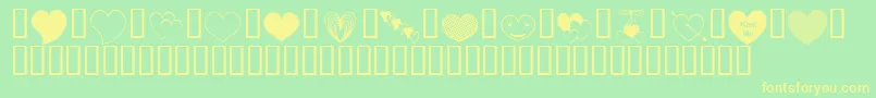 フォントApJusthearts – 黄色の文字が緑の背景にあります