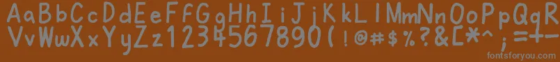 Felt-fontti – harmaat kirjasimet ruskealla taustalla