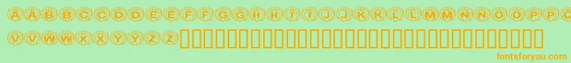 KrPerfectPumpkin-Schriftart – Orangefarbene Schriften auf grünem Hintergrund