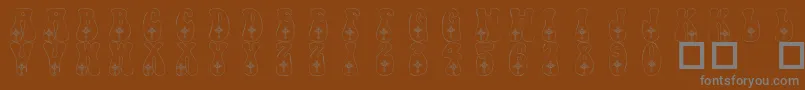 Шрифт 101CelticKnotDeco – серые шрифты на коричневом фоне