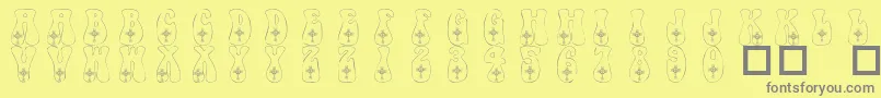 101CelticKnotDeco Font – Gray Fonts on Yellow Background