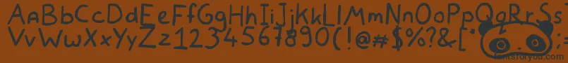 フォントWhiteBearLake – 黒い文字が茶色の背景にあります