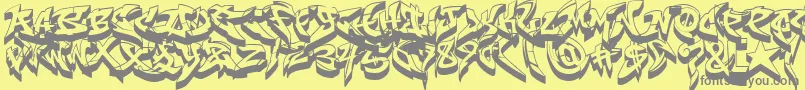 RaseoneFat3D-fontti – harmaat kirjasimet keltaisella taustalla