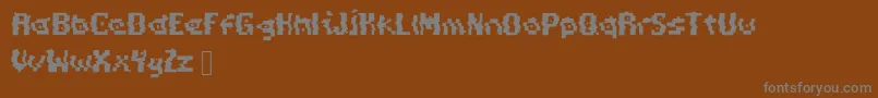 Czcionka PixelDistortion – szare czcionki na brązowym tle