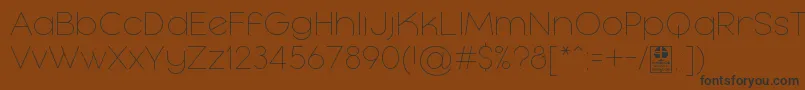 MayekaThinDemo Font – Black Fonts on Brown Background