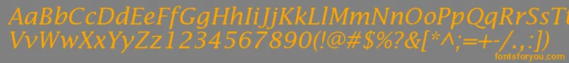 フォントLucidastdItalic – オレンジの文字は灰色の背景にあります。