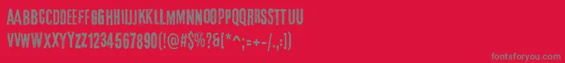 フォントElTercerHombre – 赤い背景に灰色の文字