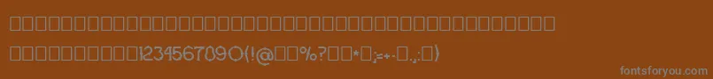 フォントOgrada – 茶色の背景に灰色の文字