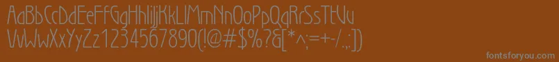 Wienlightc-Schriftart – Graue Schriften auf braunem Hintergrund
