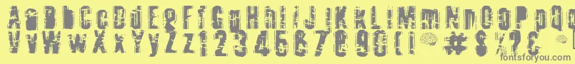 Toota ffy-fontti – harmaat kirjasimet keltaisella taustalla