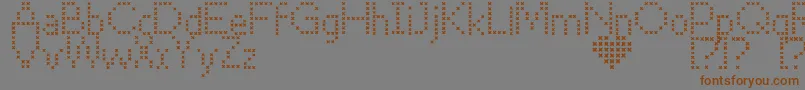 CrossStitch-Schriftart – Braune Schriften auf grauem Hintergrund