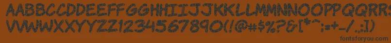 KomikaKrak Font – Black Fonts on Brown Background