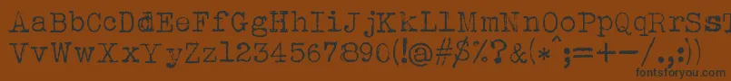 AlbertsthalTypewriter-Schriftart – Schwarze Schriften auf braunem Hintergrund