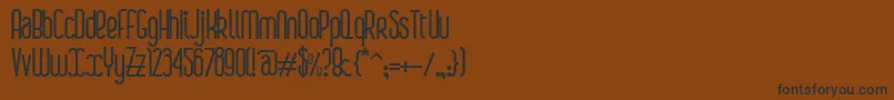 フォントBoaР™Bold – 黒い文字が茶色の背景にあります