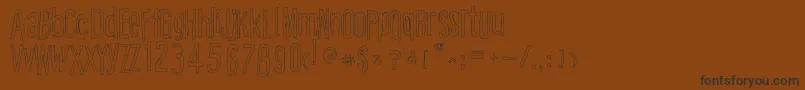 CartoonEastOutline Font – Black Fonts on Brown Background