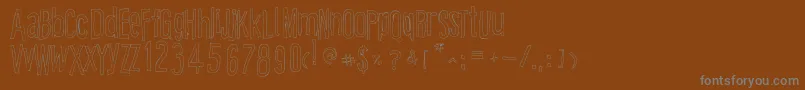 CartoonEastOutline Font – Gray Fonts on Brown Background