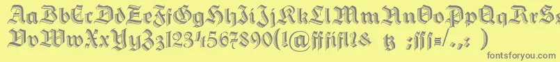 フォントHermannGotischc – 黄色の背景に灰色の文字