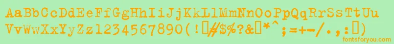 フォントTrixieplain – オレンジの文字が緑の背景にあります。