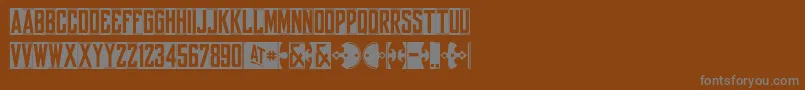 Yorkwhiteletter-fontti – harmaat kirjasimet ruskealla taustalla