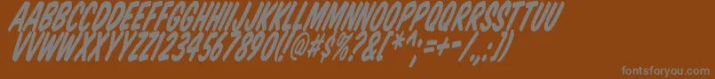 Komtittl-fontti – harmaat kirjasimet ruskealla taustalla