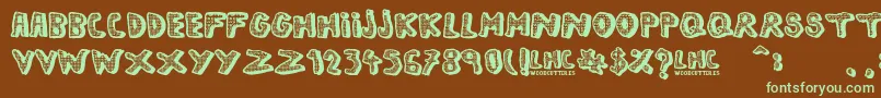フォントLeftHandComic – 緑色の文字が茶色の背景にあります。