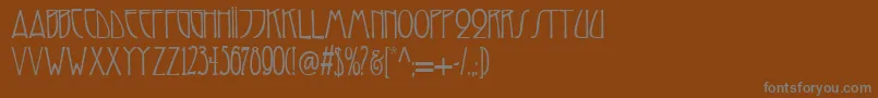 フォントReynold – 茶色の背景に灰色の文字