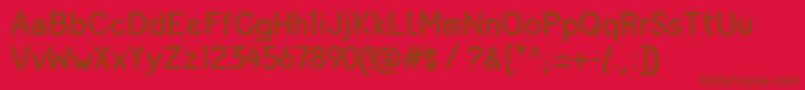 MandingaRegular-Schriftart – Braune Schriften auf rotem Hintergrund