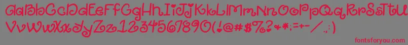 2peasGiggle Font – Red Fonts on Gray Background