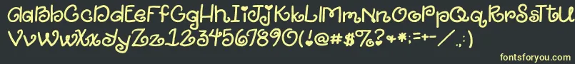 2peasGiggle Font – Yellow Fonts on Black Background