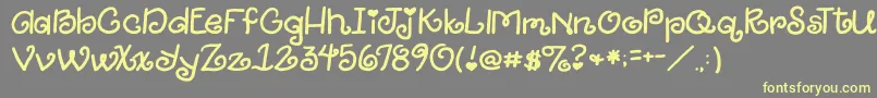 2peasGiggle Font – Yellow Fonts on Gray Background