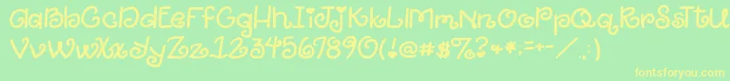 2peasGiggle Font – Yellow Fonts on Green Background
