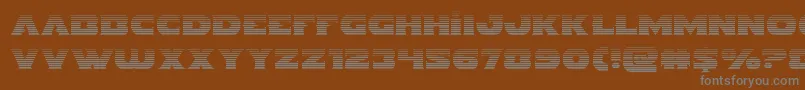 Indigodemongrad-fontti – harmaat kirjasimet ruskealla taustalla
