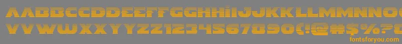 フォントIndigodemongrad – オレンジの文字は灰色の背景にあります。