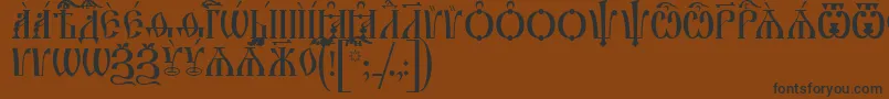 IrmologionCapsUcs-Schriftart – Schwarze Schriften auf braunem Hintergrund