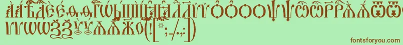フォントIrmologionCapsUcs – 緑の背景に茶色のフォント