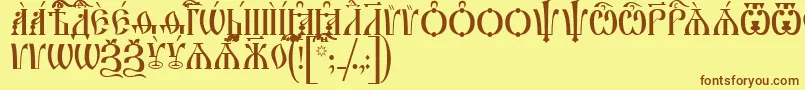 フォントIrmologionCapsUcs – 茶色の文字が黄色の背景にあります。