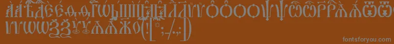IrmologionCapsUcs-fontti – harmaat kirjasimet ruskealla taustalla