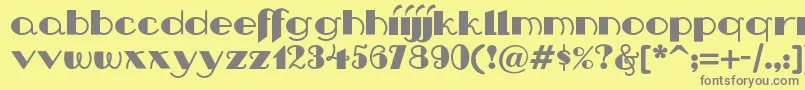 フォントNipandtucknf – 黄色の背景に灰色の文字