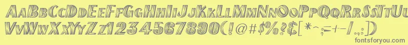 New Mexico-fontti – harmaat kirjasimet keltaisella taustalla